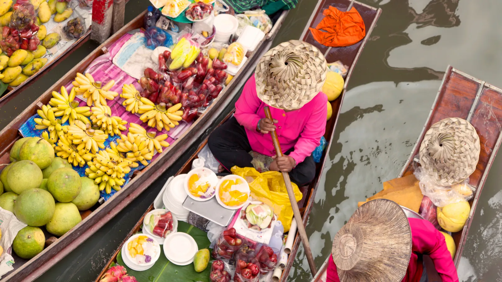 Floating market fruit vendor boats, Thailand, for retirement planning