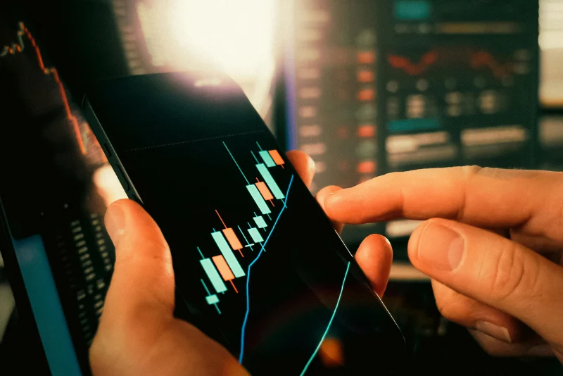 Mobile phone showing financial data for foreign income remittance tax planning