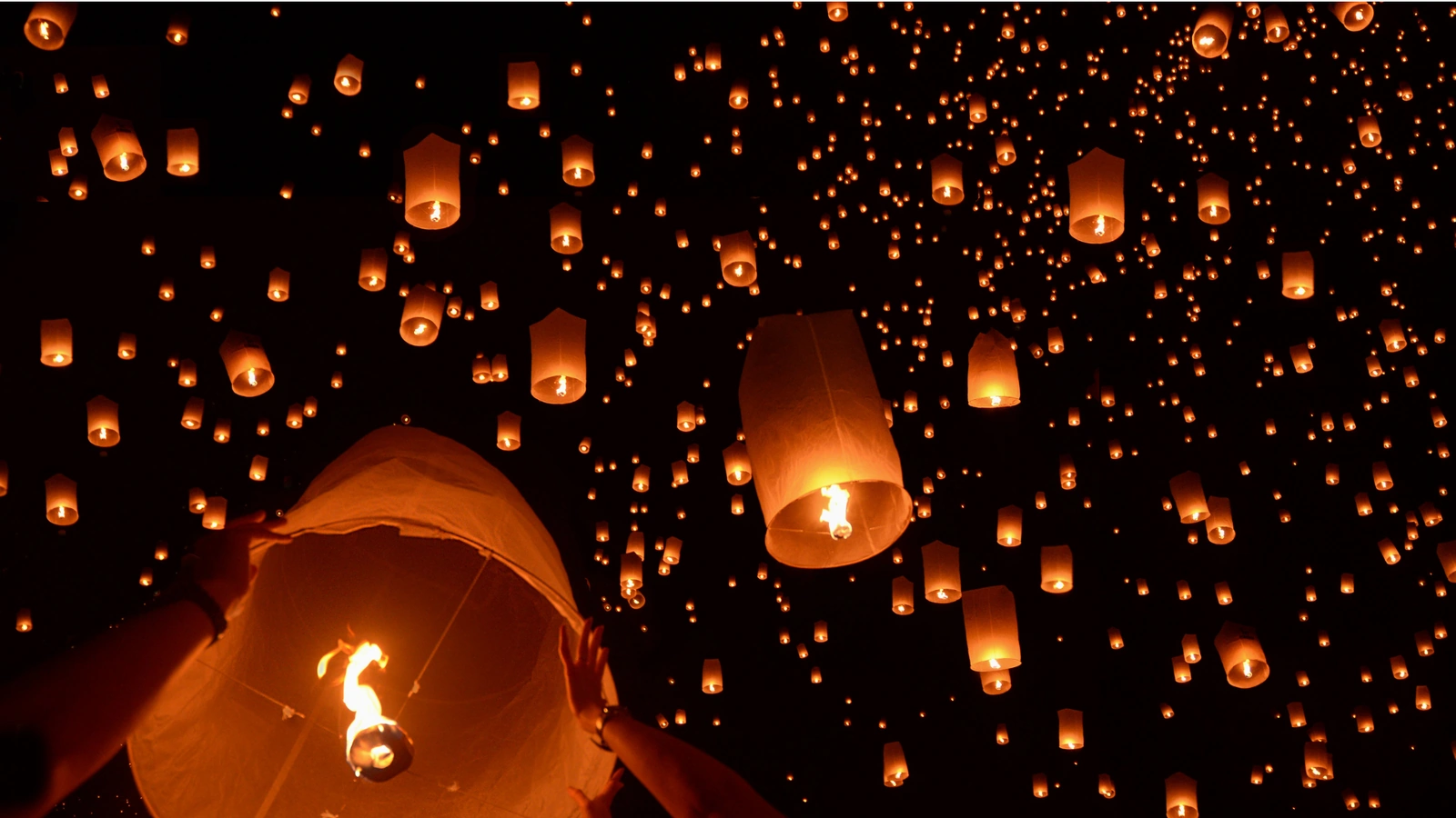 Sky lanterns rising during Yi Peng festival, Thailand